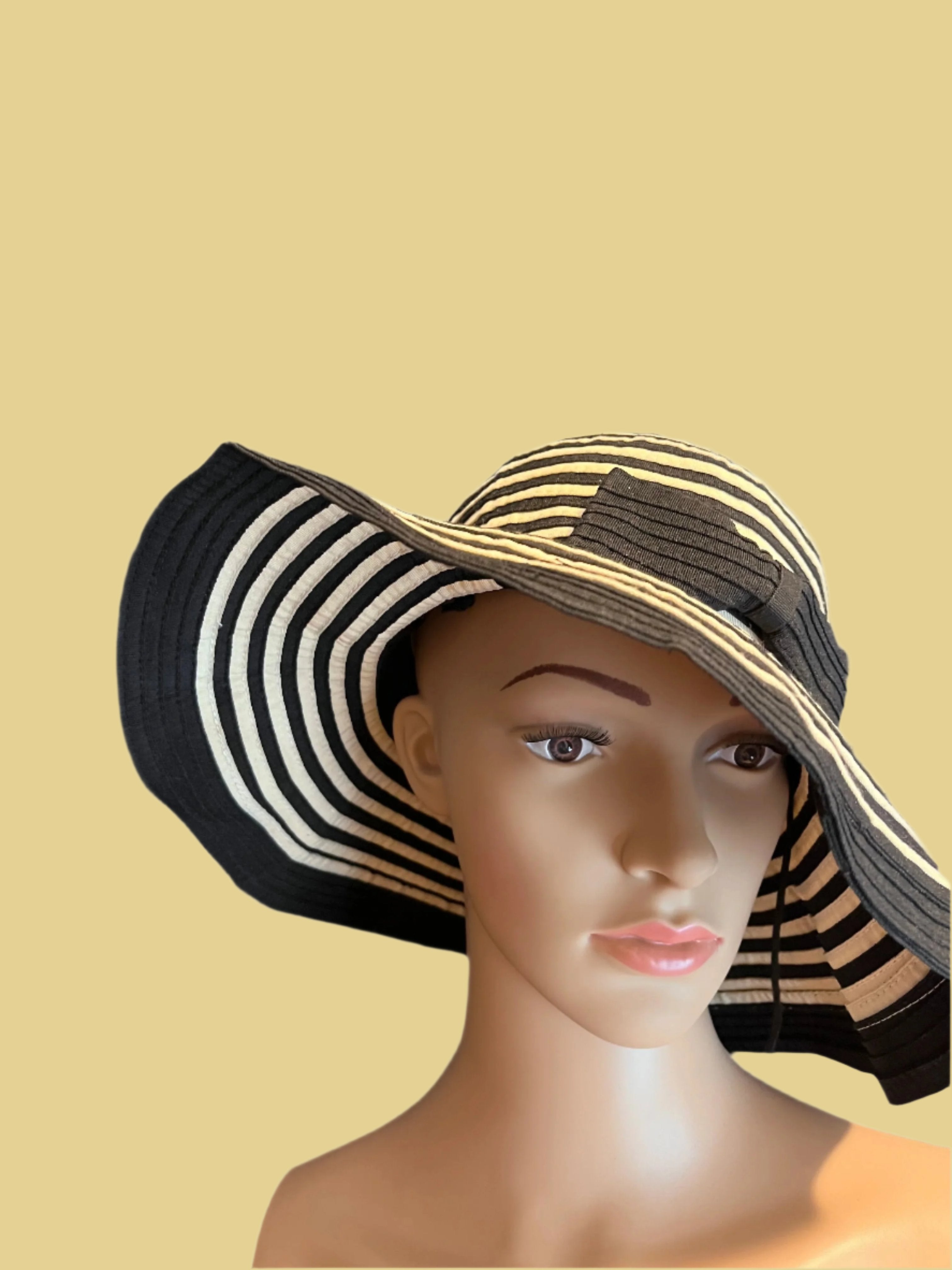 Beautiful black and beige hat with nice ribbon by Sun Sand