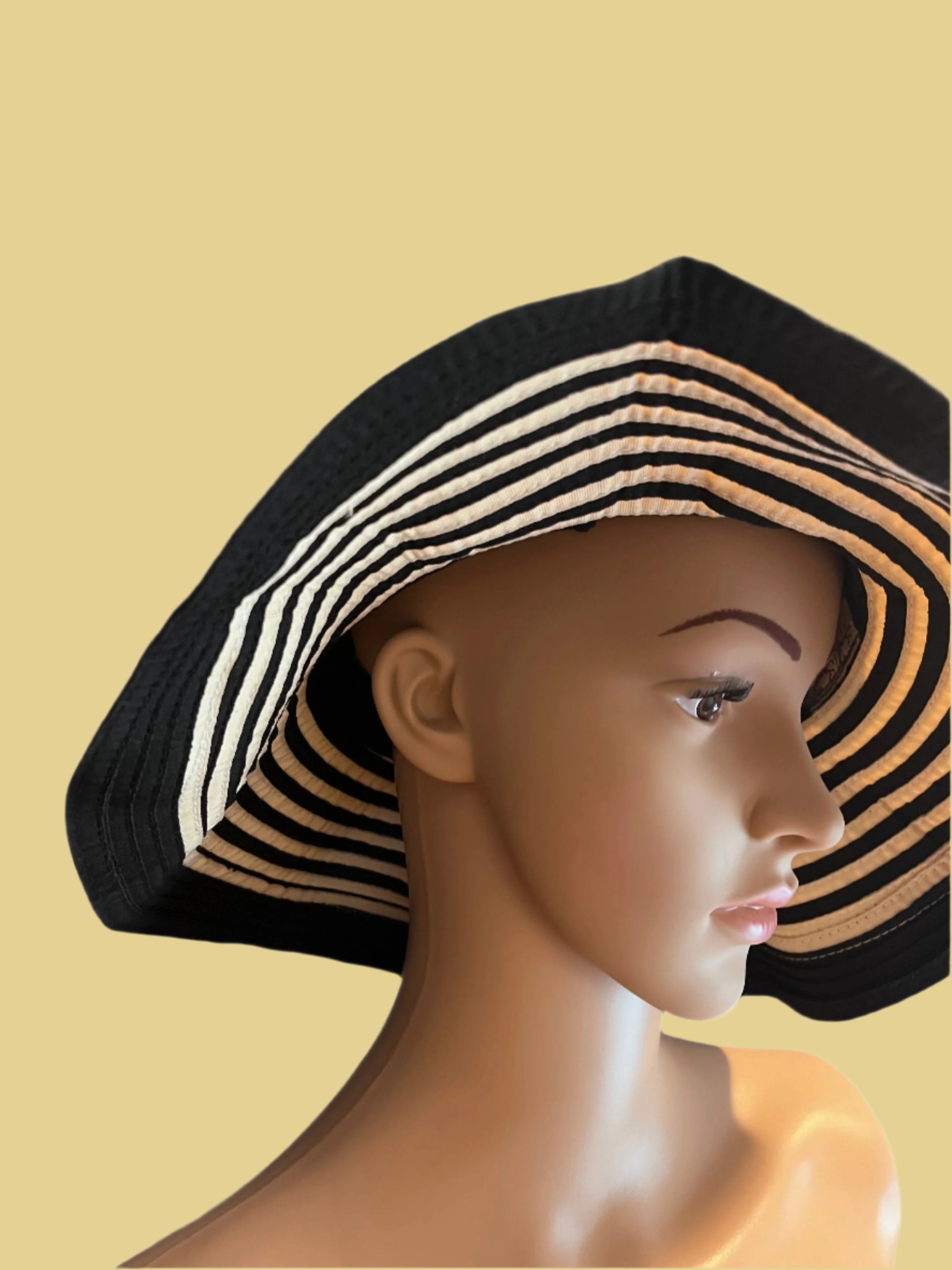 Beautiful black and beige hat with nice ribbon by Sun Sand